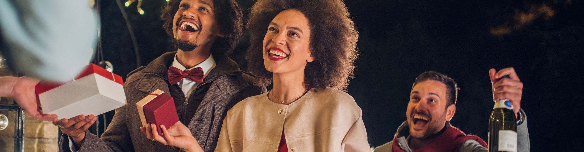 A group of people holding boxes.