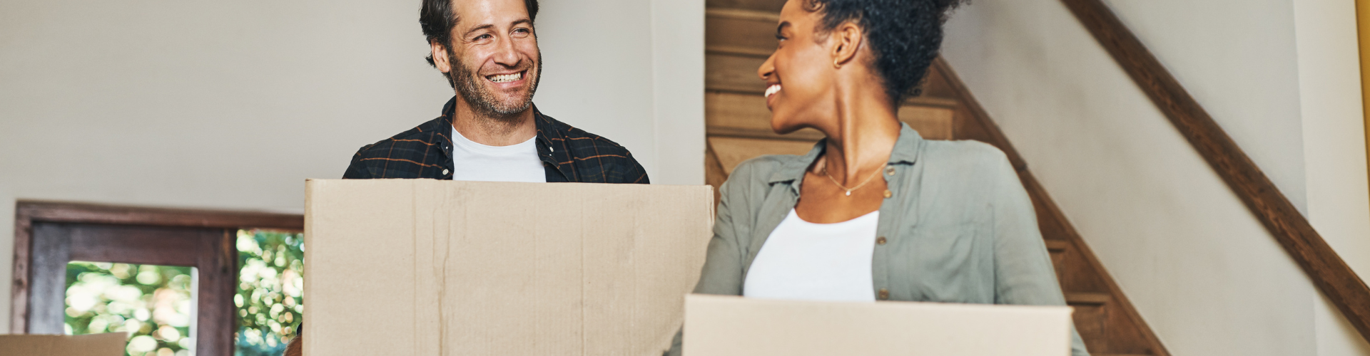 A man and a woman laughing.