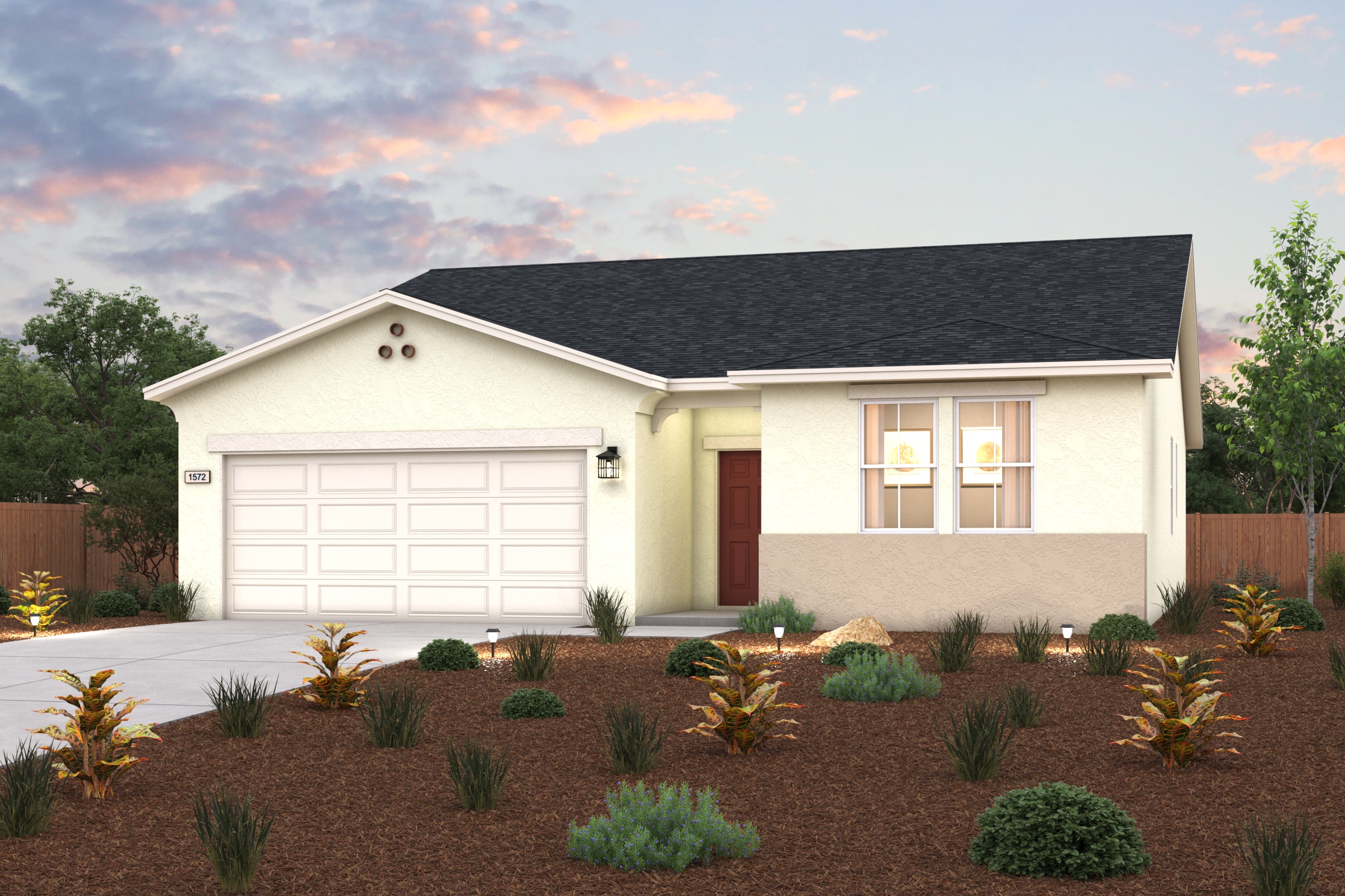 A house with a garage and bushes.