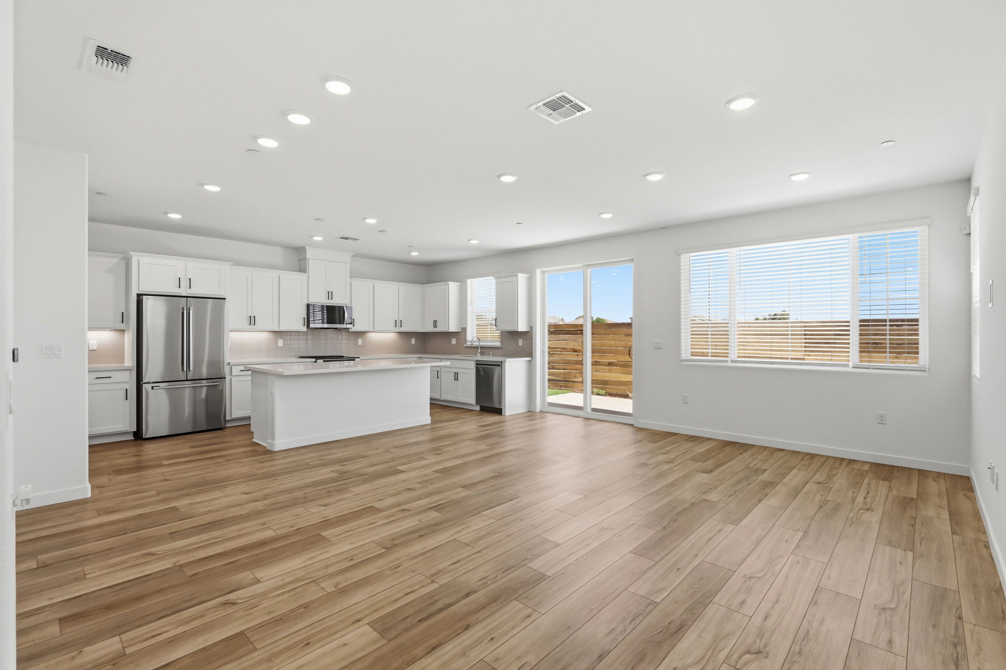 A large kitchen with white cabinets.