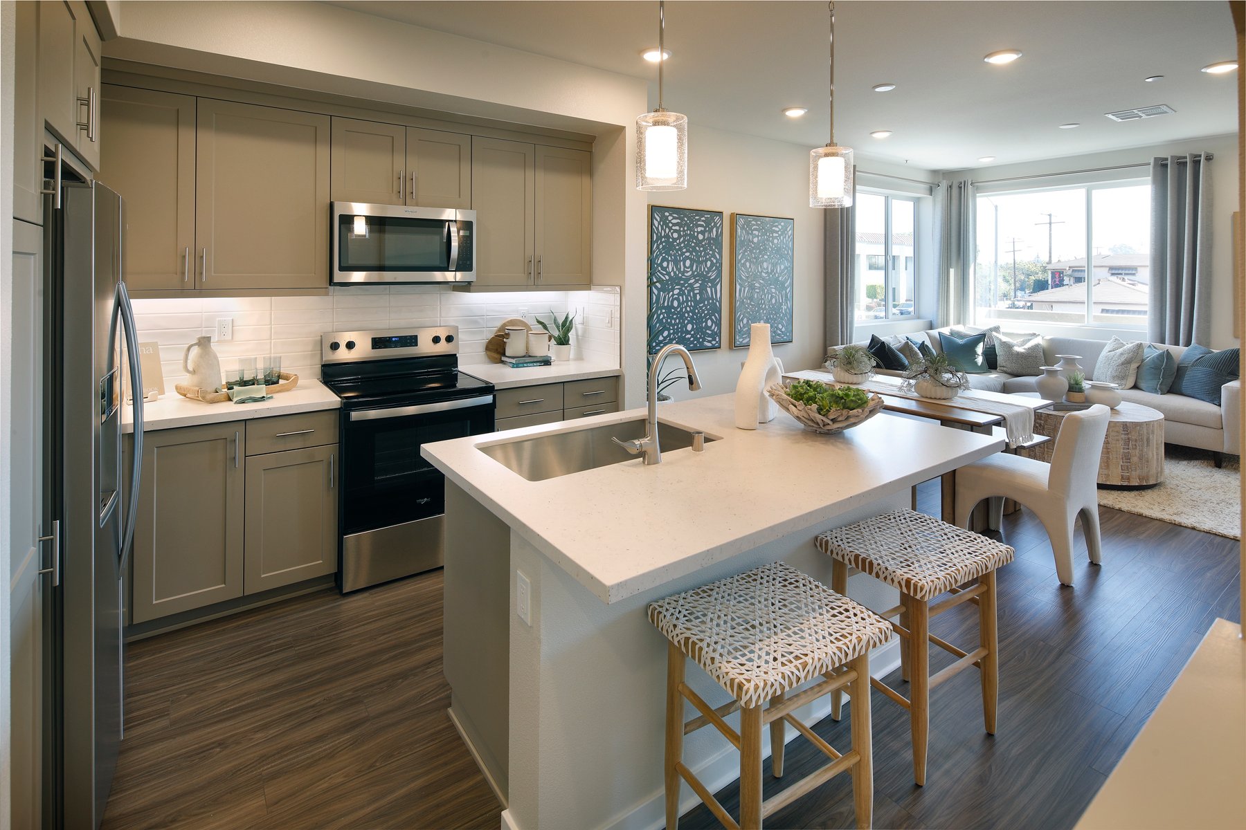 A kitchen with a bar stool and a bar stool.
