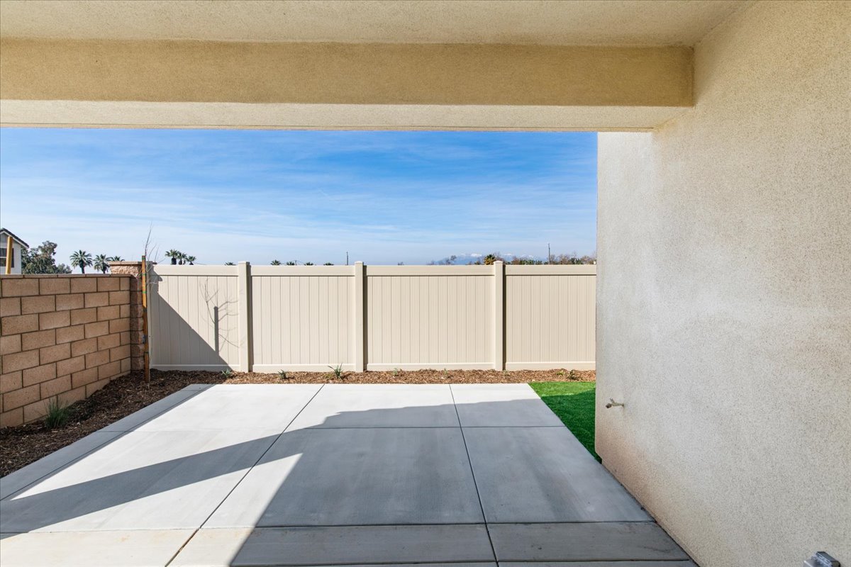 A white fence with a white gate.
