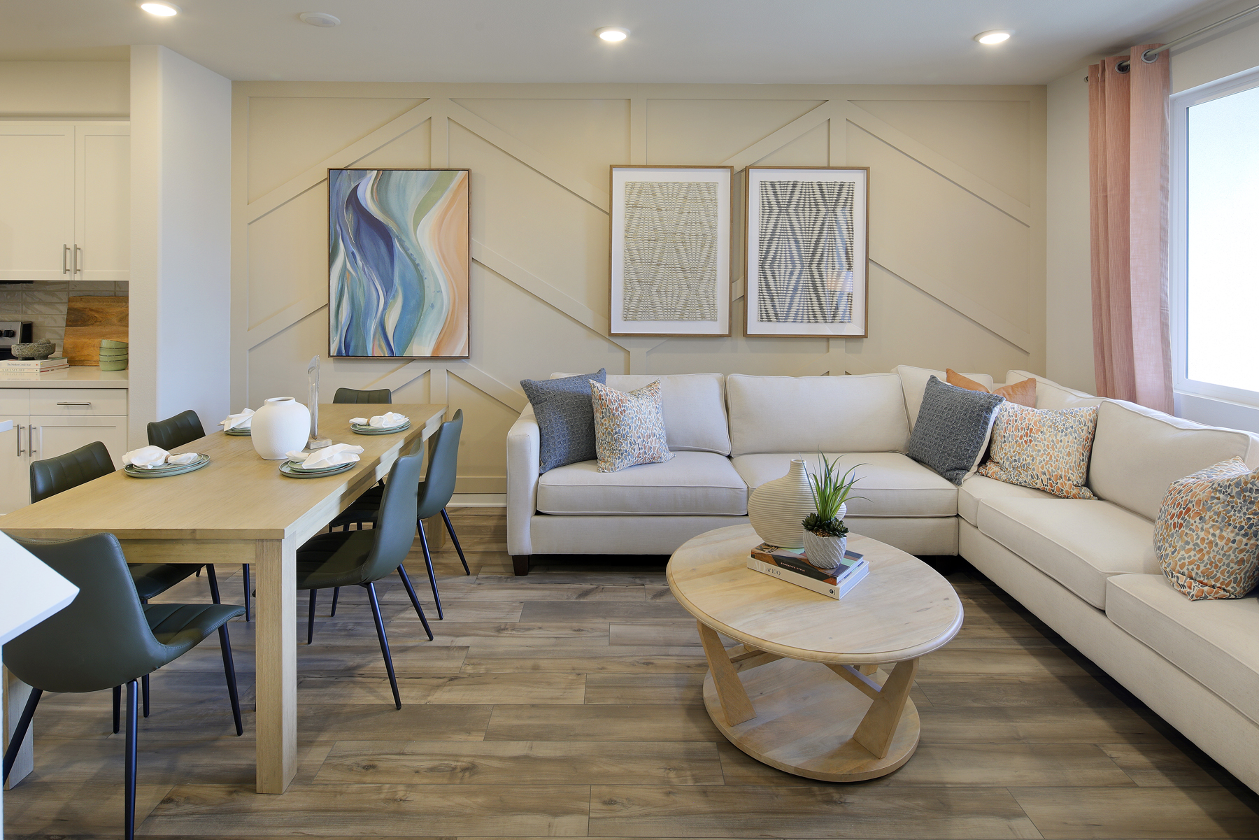 A living room with a table and chairs.
