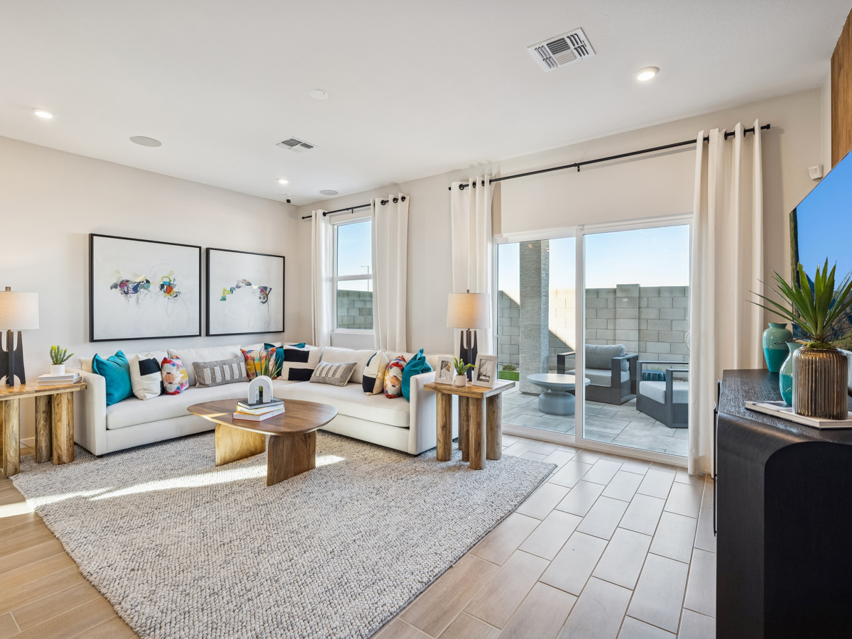 A living room with a large glass door.