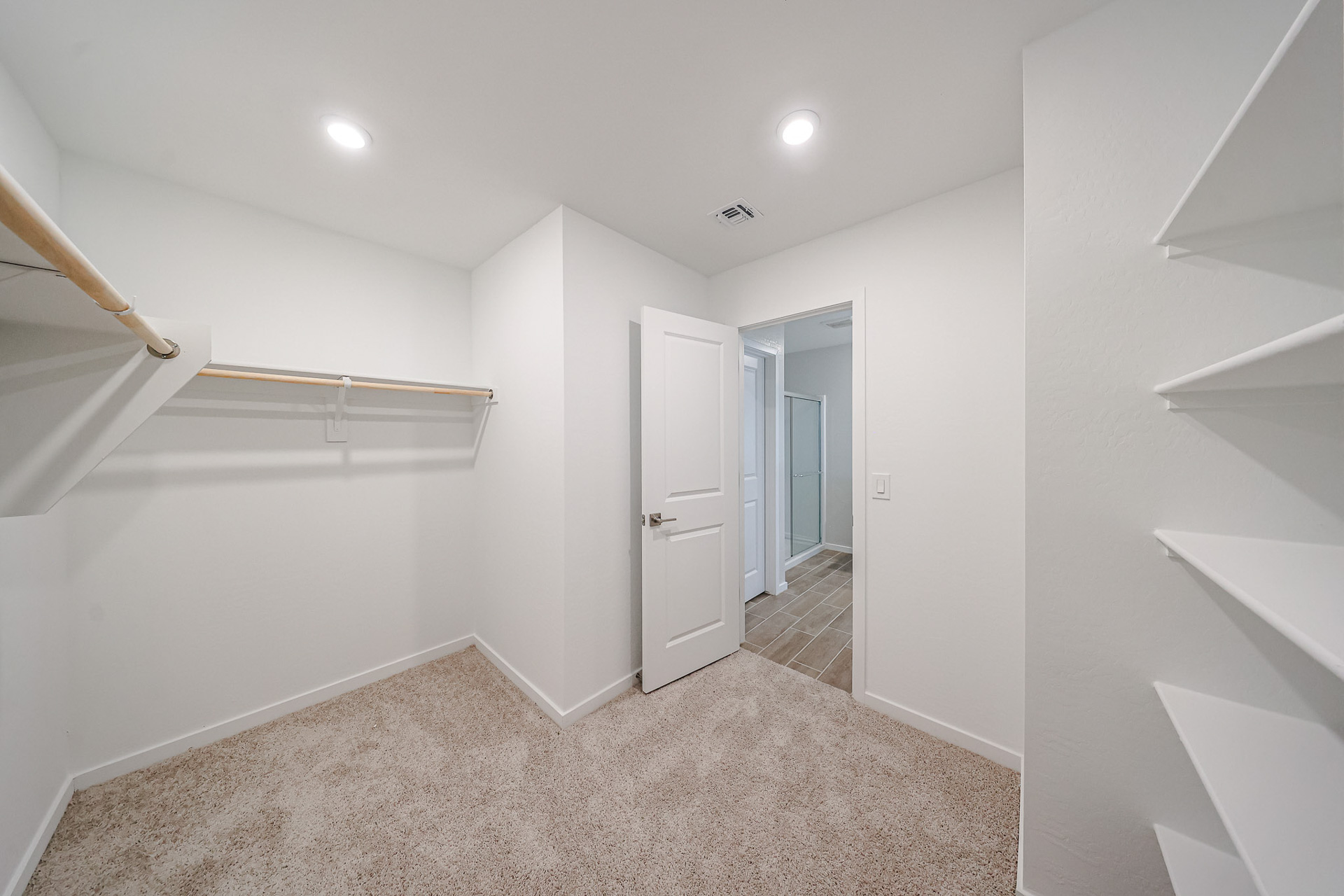 A hallway with white walls.
