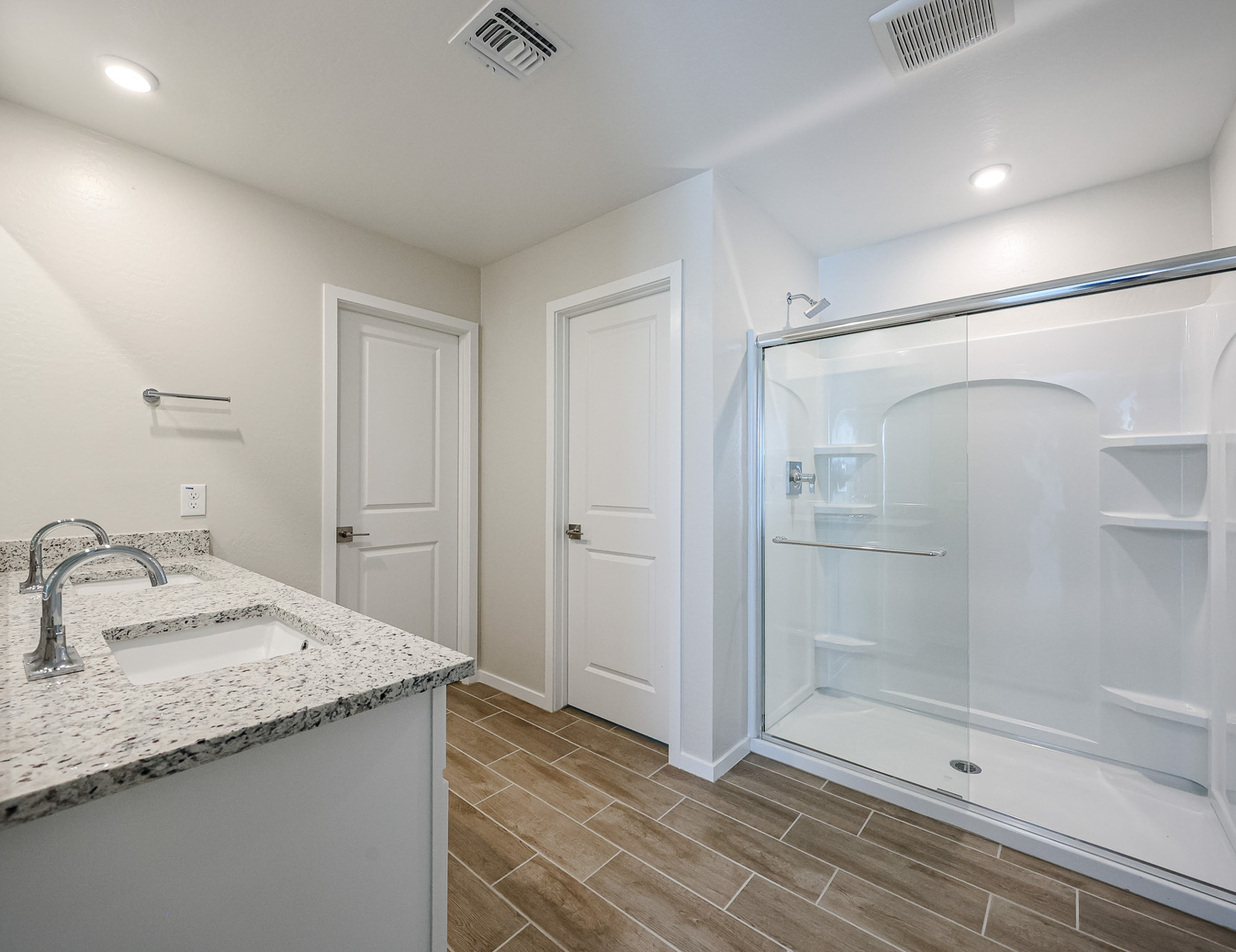 A bathroom with a glass shower.