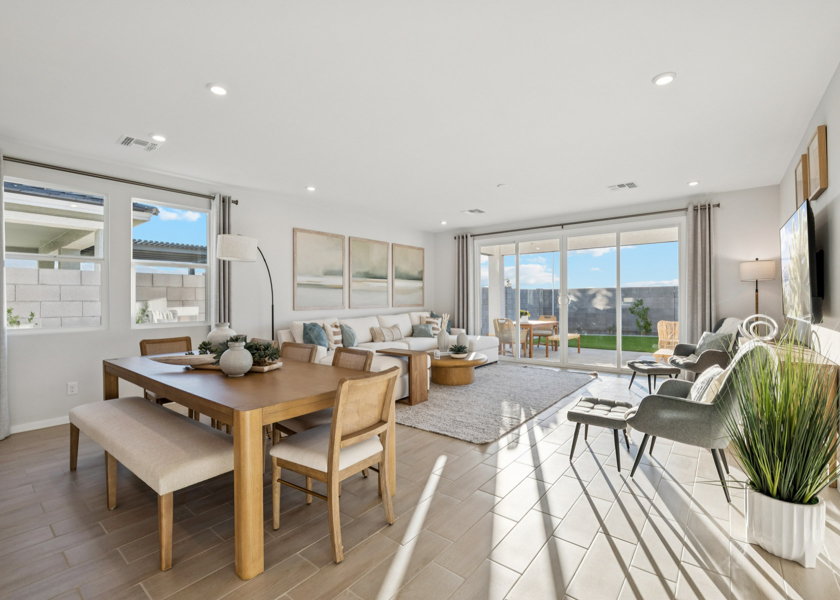 A large room with a table and chairs.