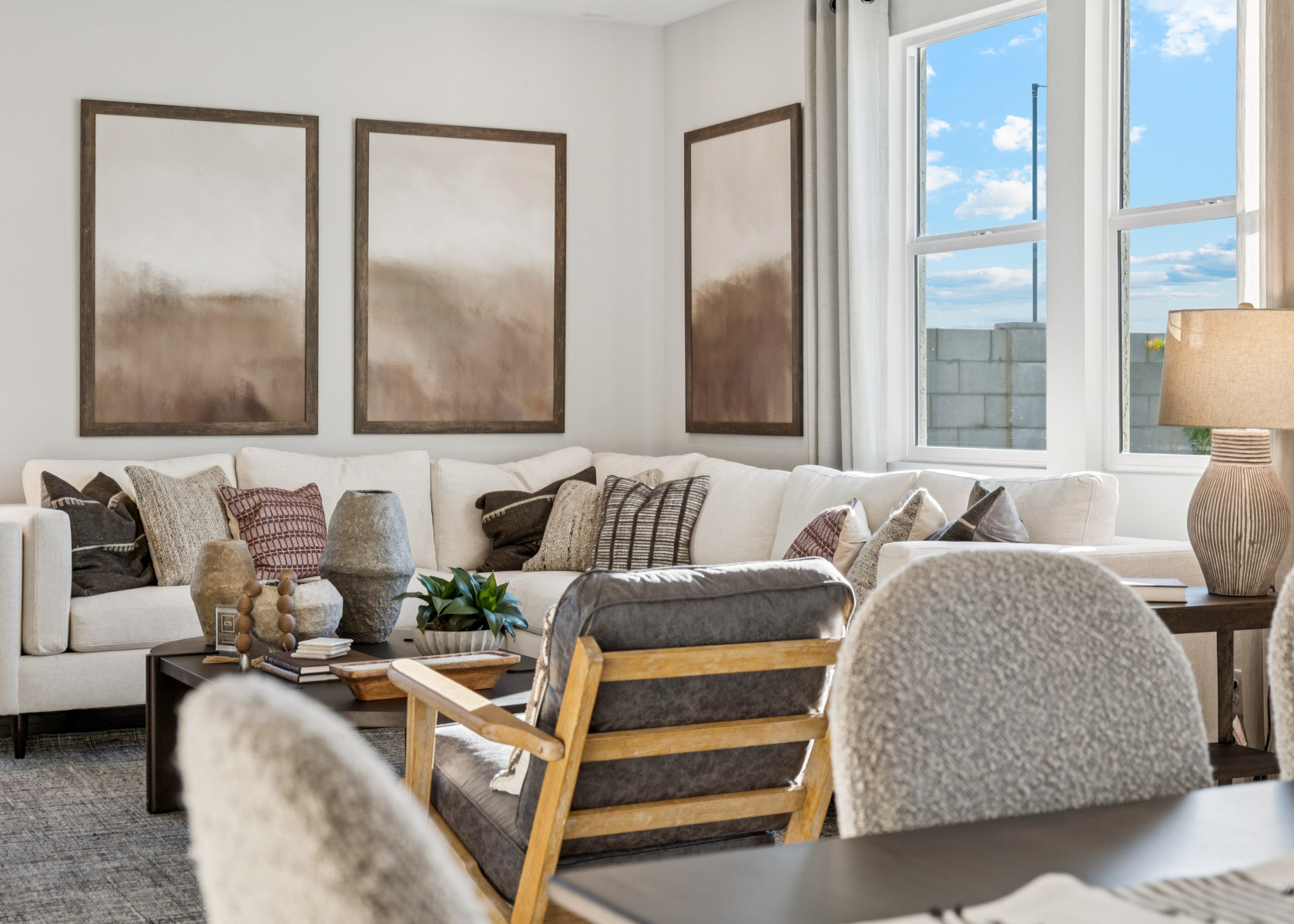 A living room with a couch and chairs.