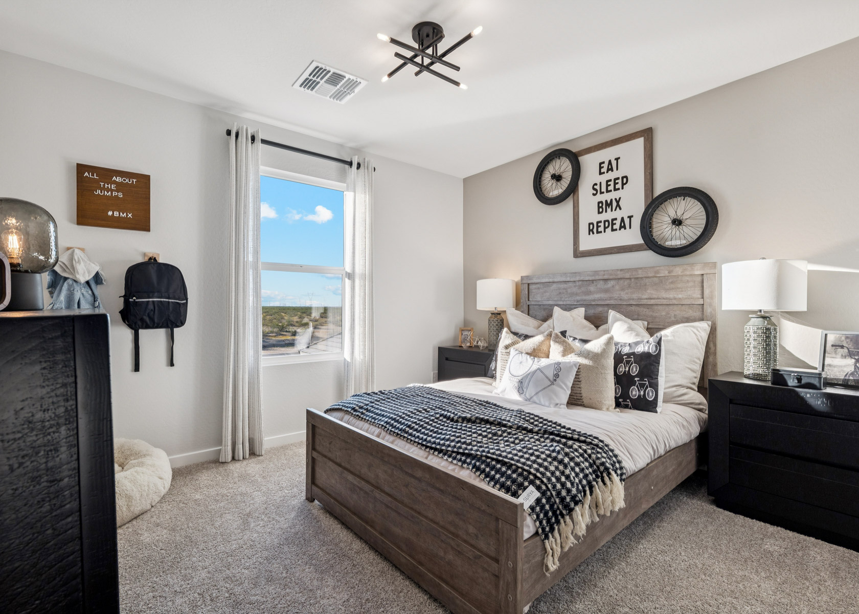 A bedroom with a bed and a window.