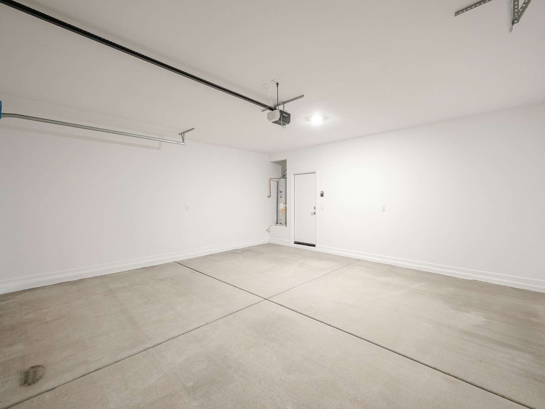 A hallway with white walls.