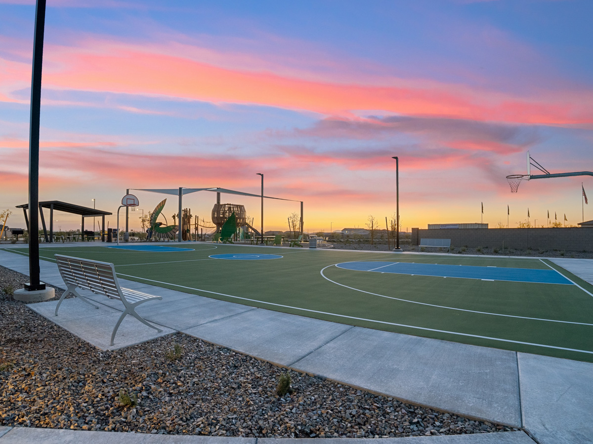 A basketball court with a sunset.