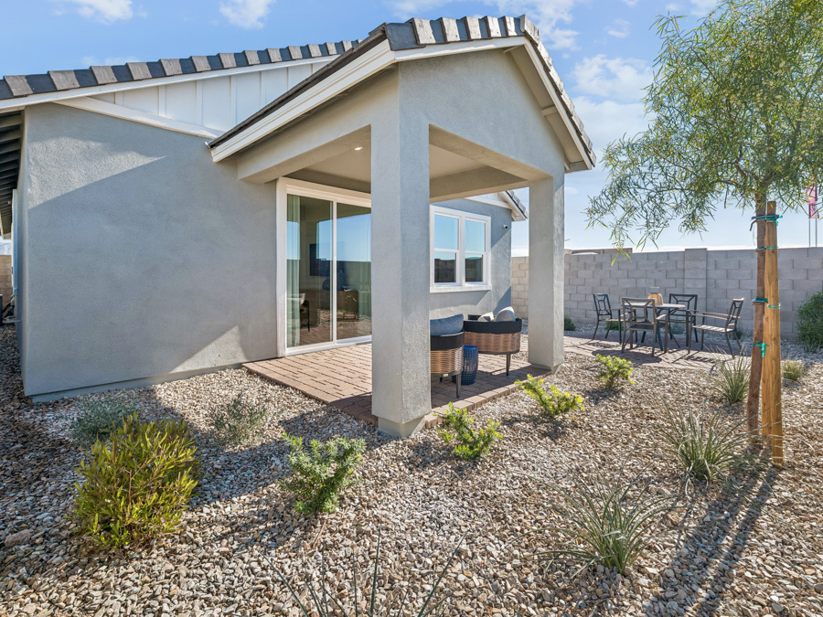 A house with a patio and a tree.