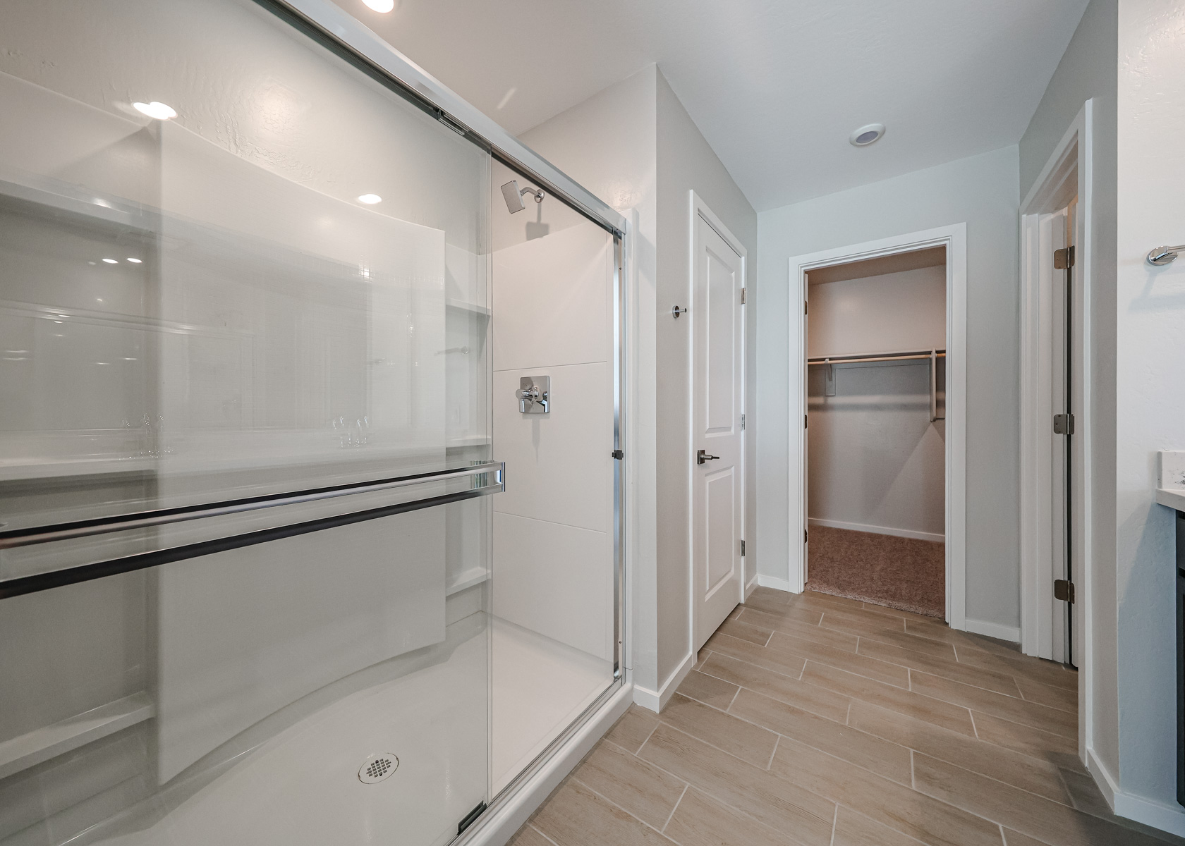 A bathroom with a glass shower.