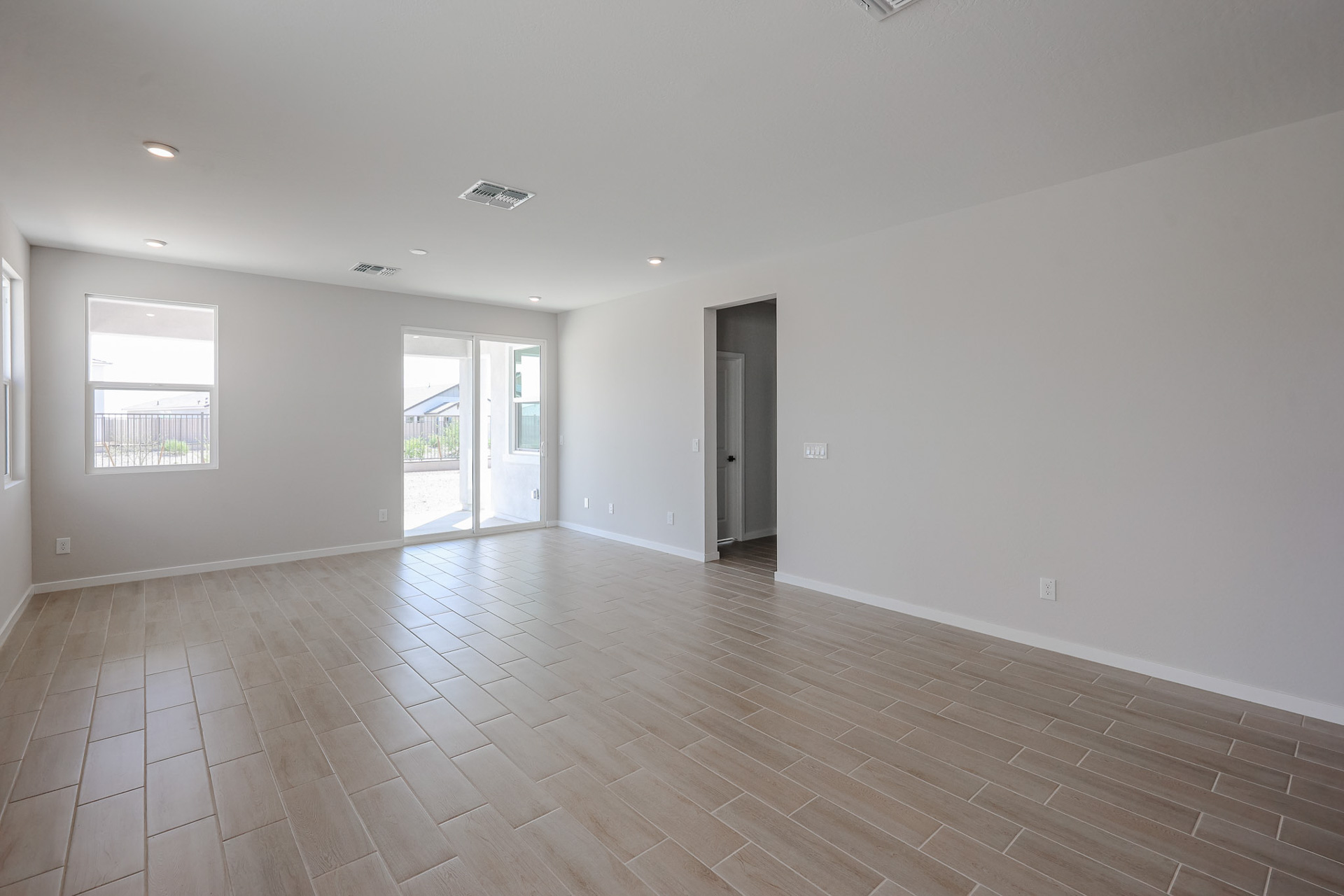 A room with a wood floor and a wood floor.