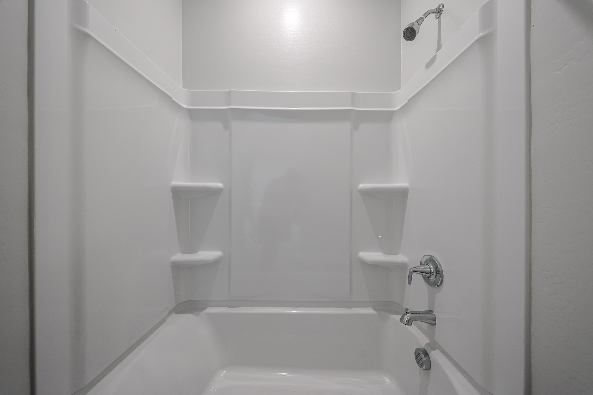 A bathroom with a bathtub toilet and sink.