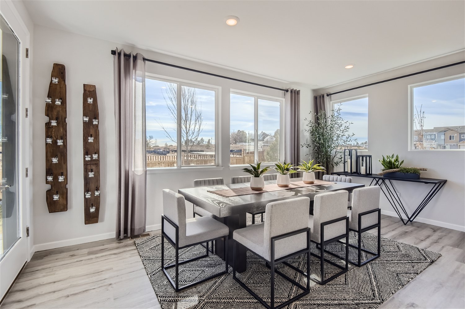 A dining room with a large window.