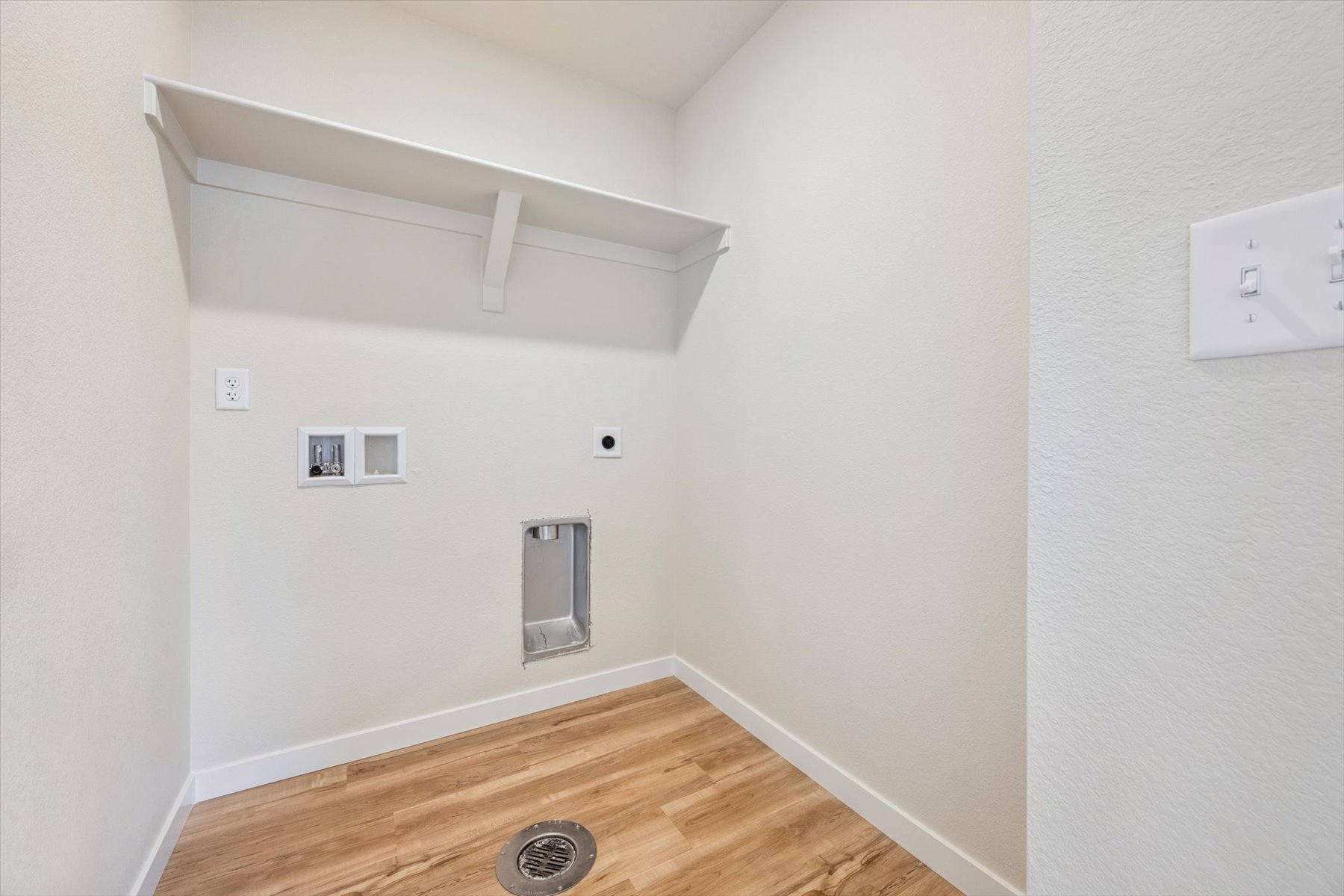 A room with a wood floor and a wood floor.