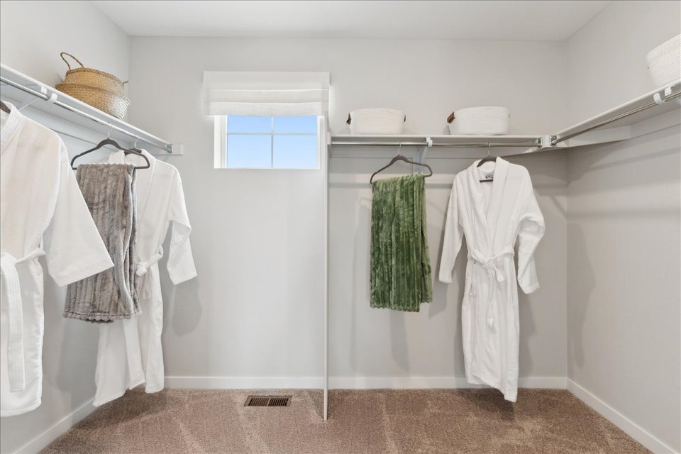 A bathroom with white clothes.