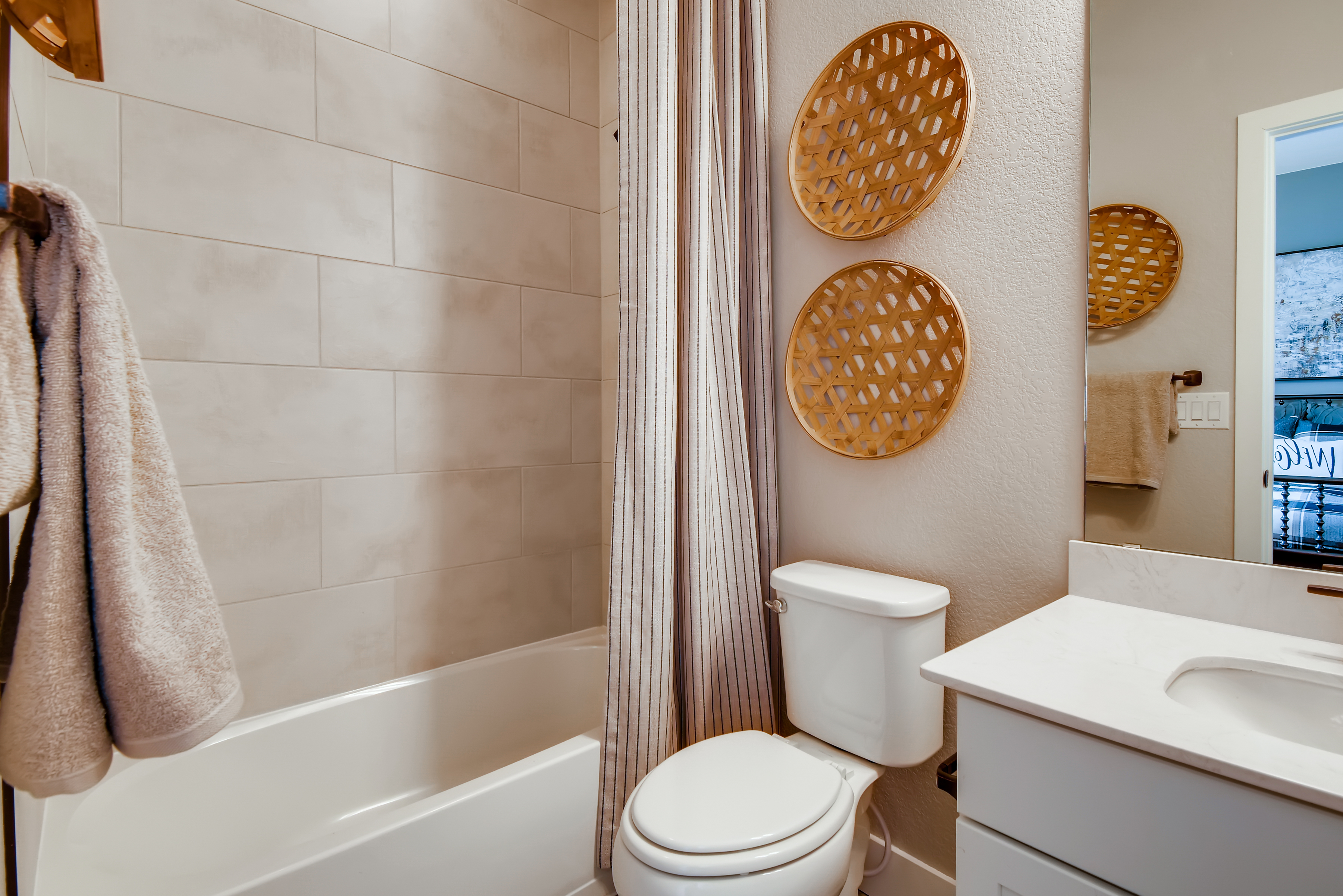 A bathroom with a toilet and sink.