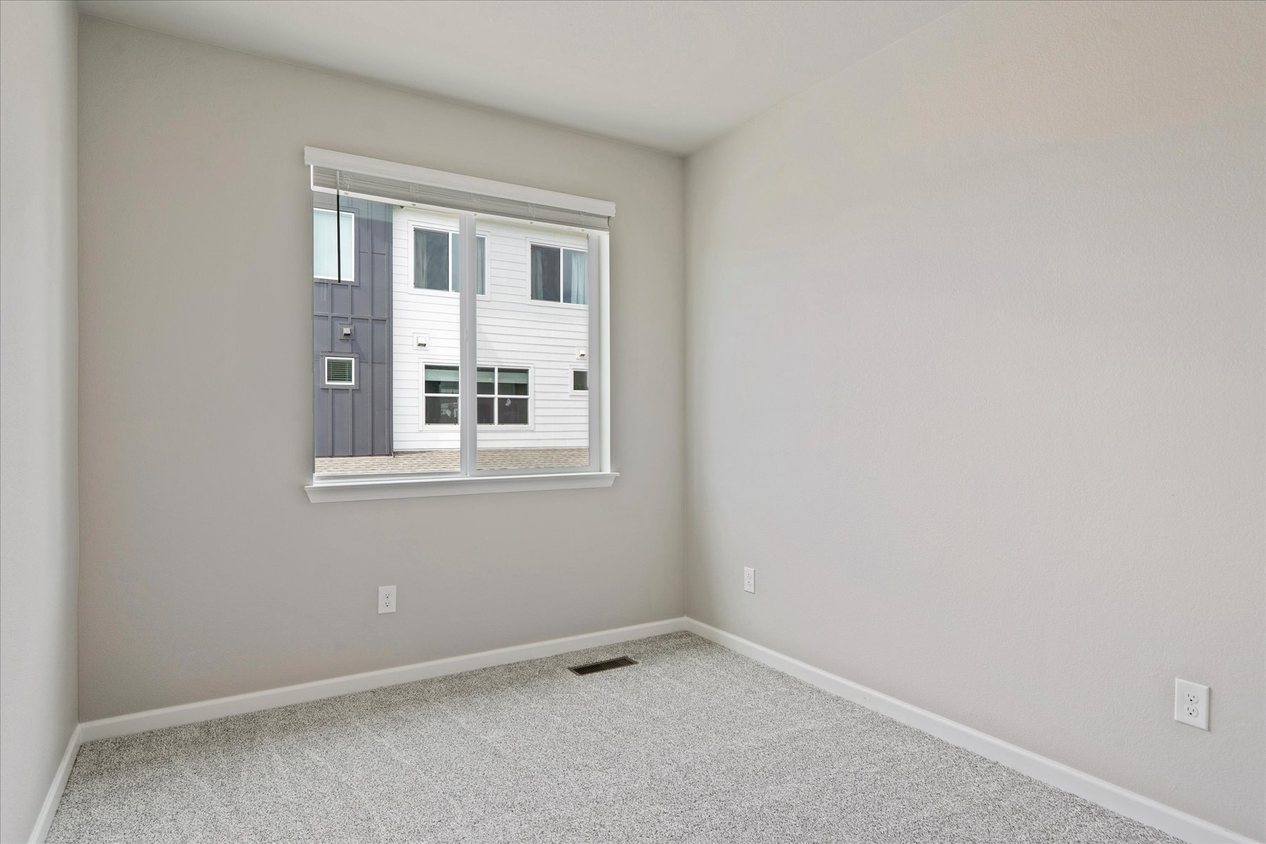 A room with a window and a door.