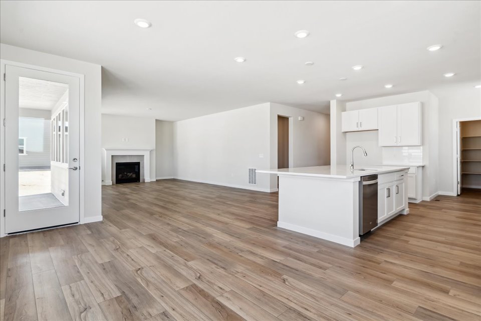 A large kitchen with white cabinets.