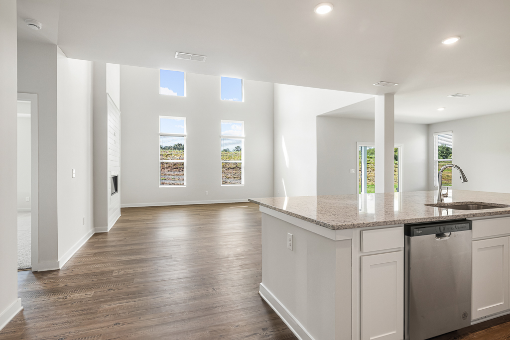 A large kitchen with white cabinets.