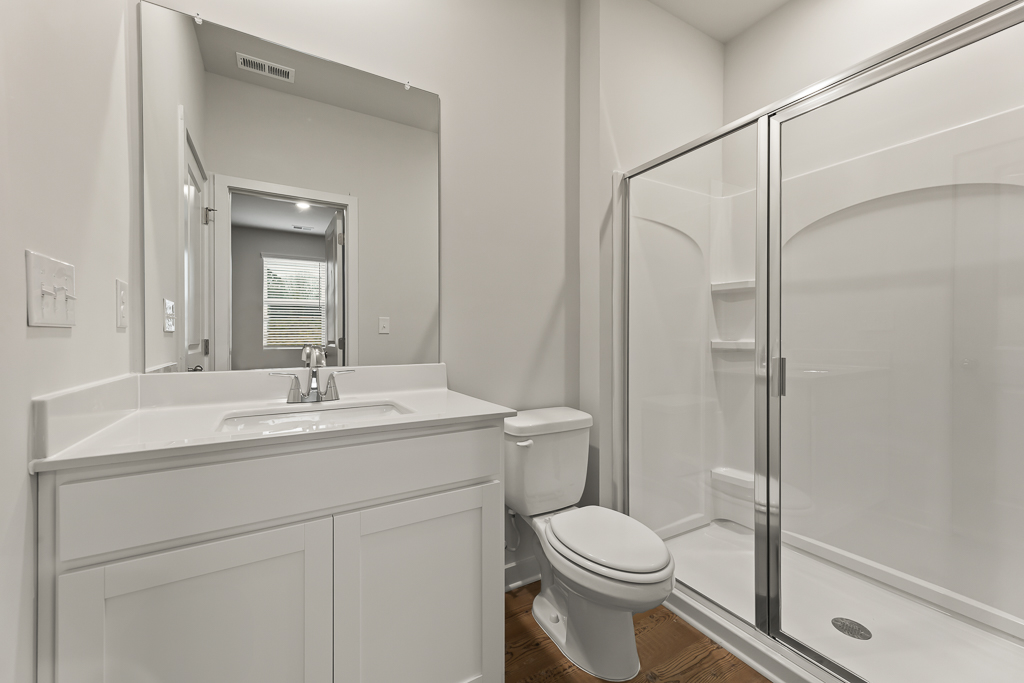 A bathroom with a glass shower.