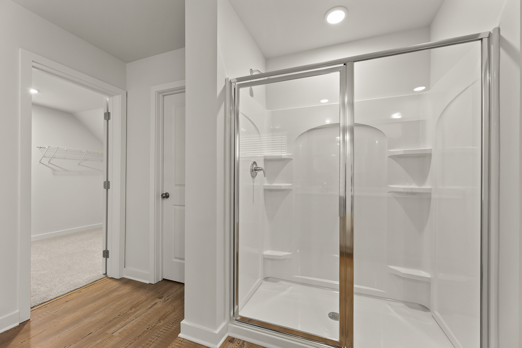 A bathroom with a glass shower.