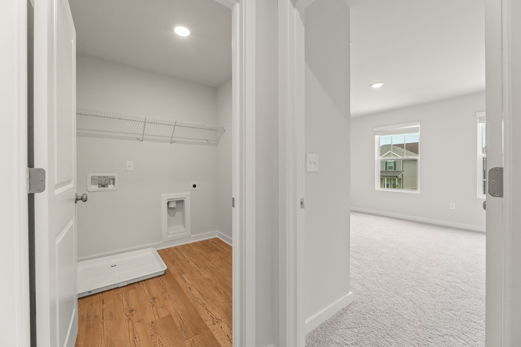 A hallway with white walls.