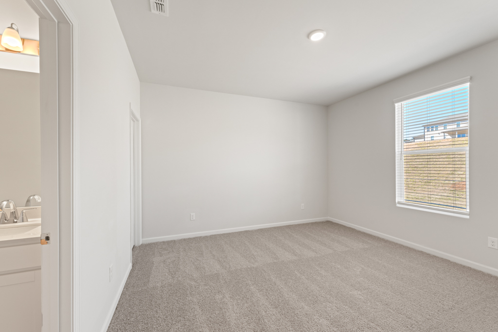 A room with a sink and a window.