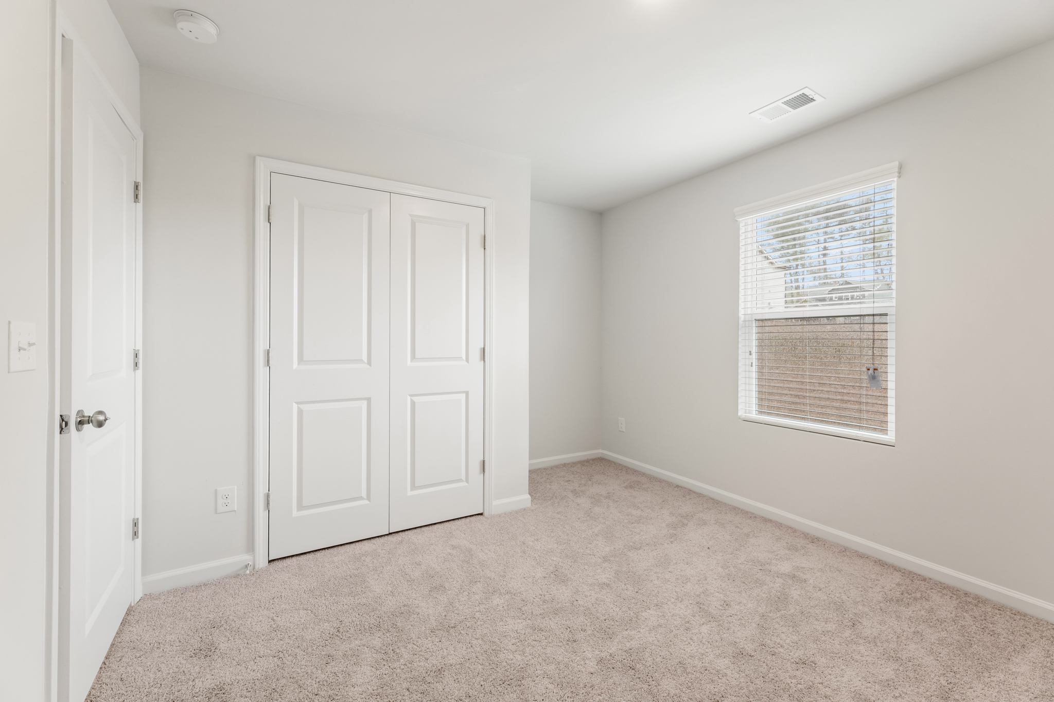 A room with white doors.