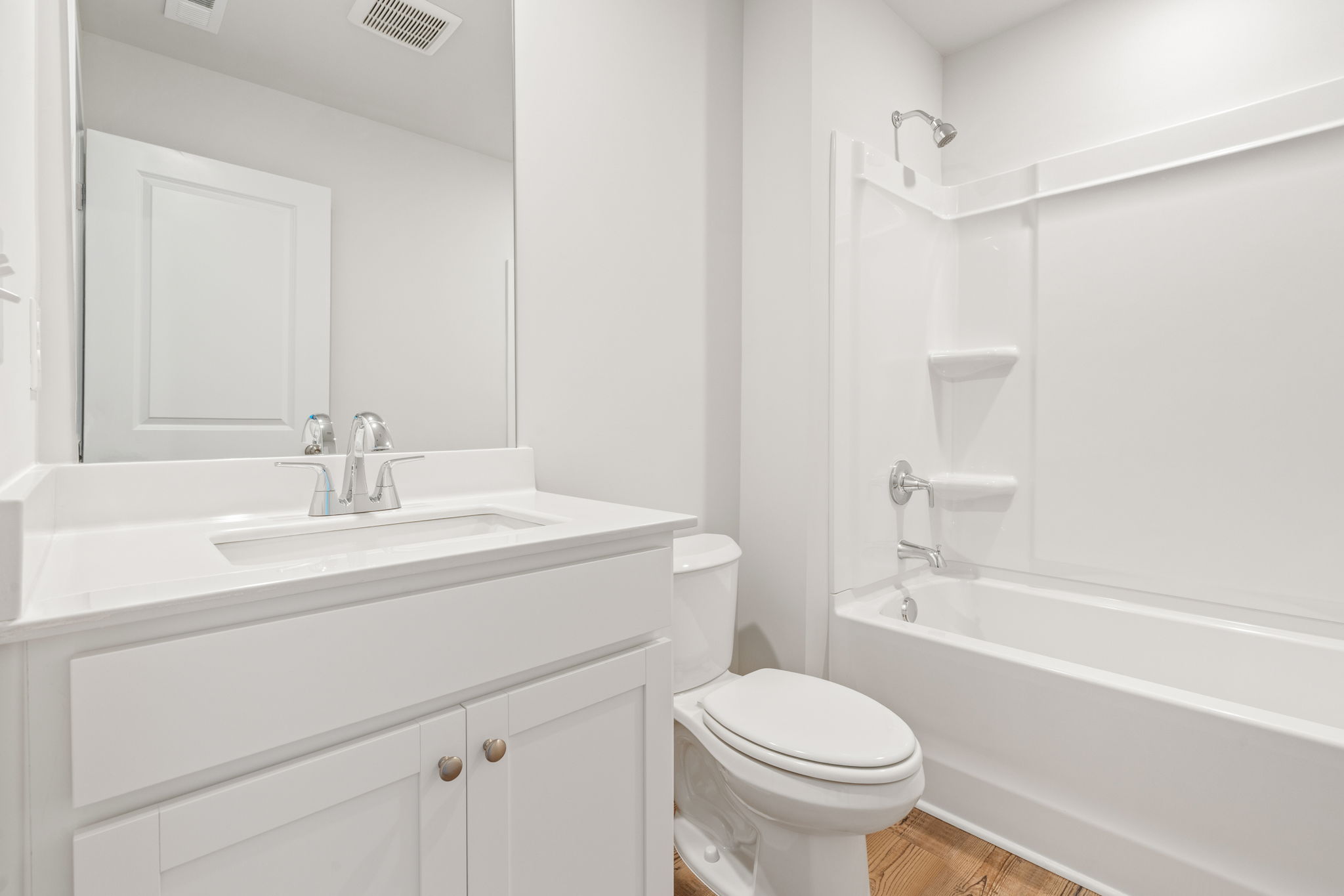 A bathroom with a toilet and sink.
