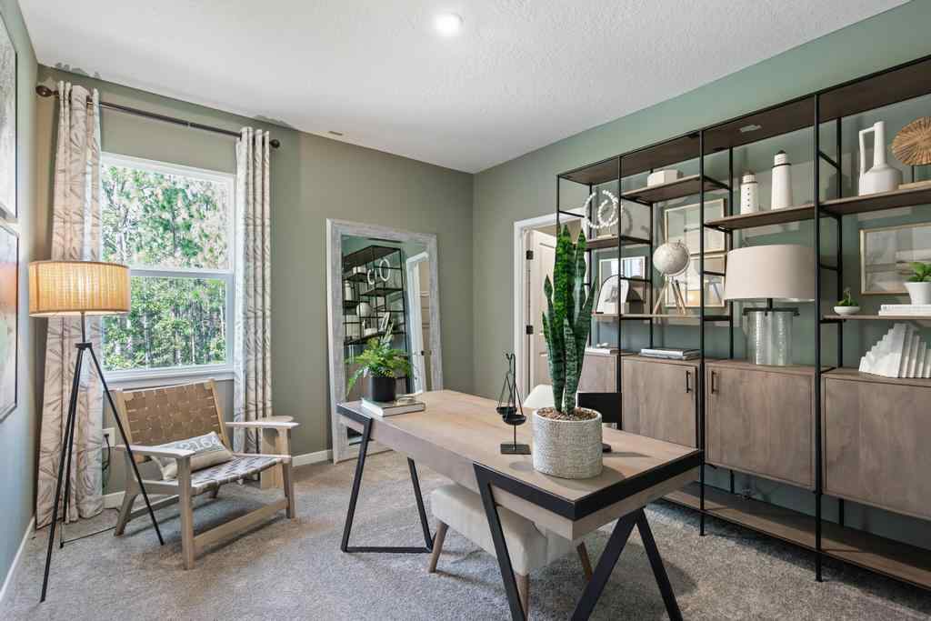 A room with a table and chairs.