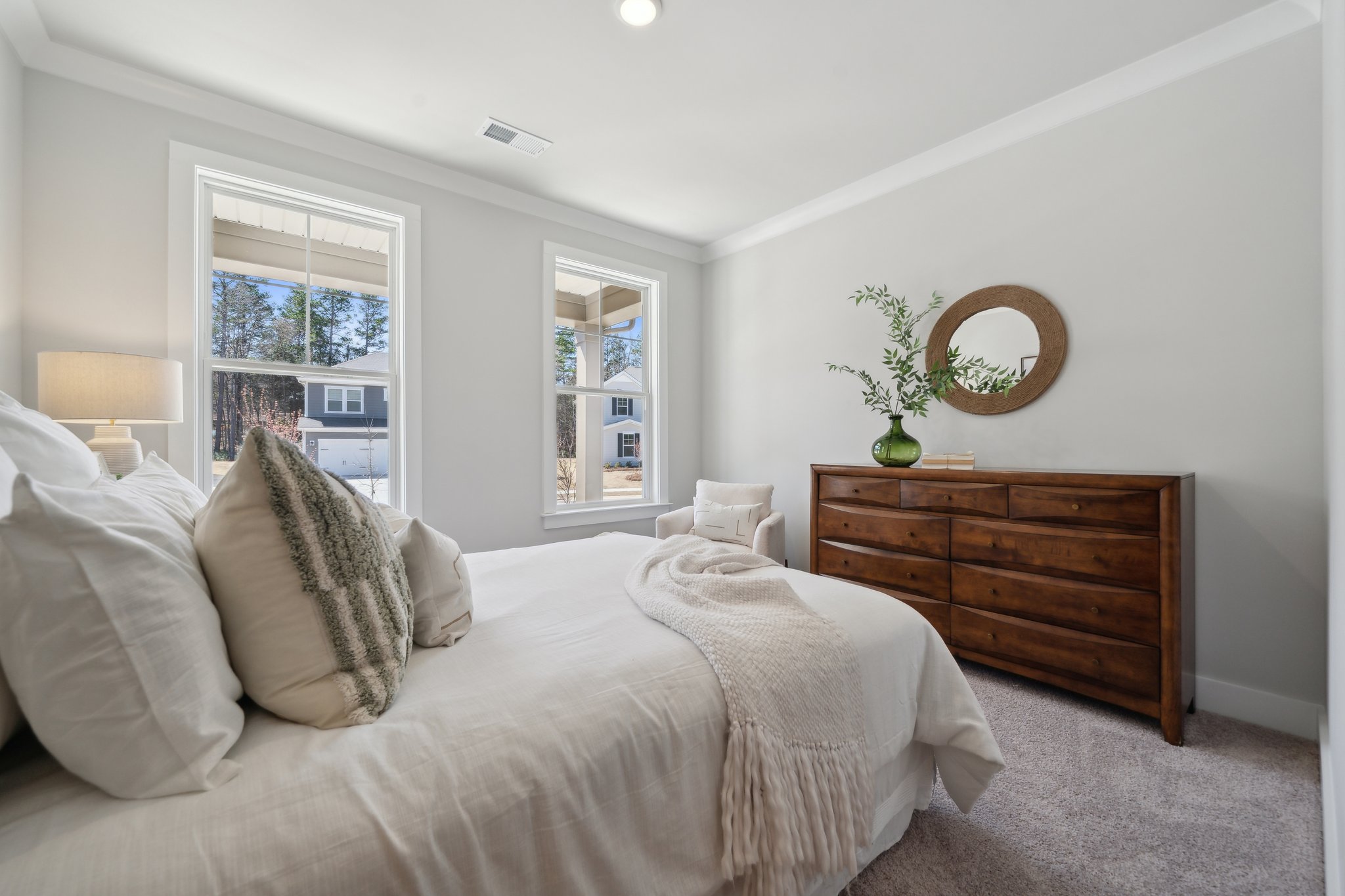 A bed with white pillows.