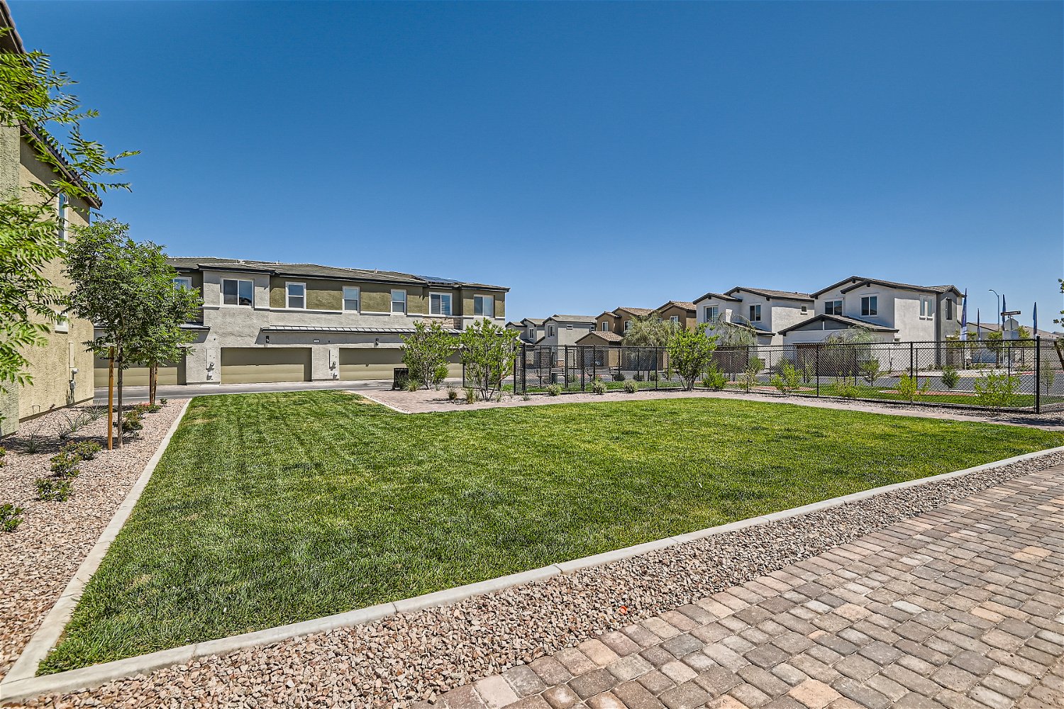 A brick path leading to a building.