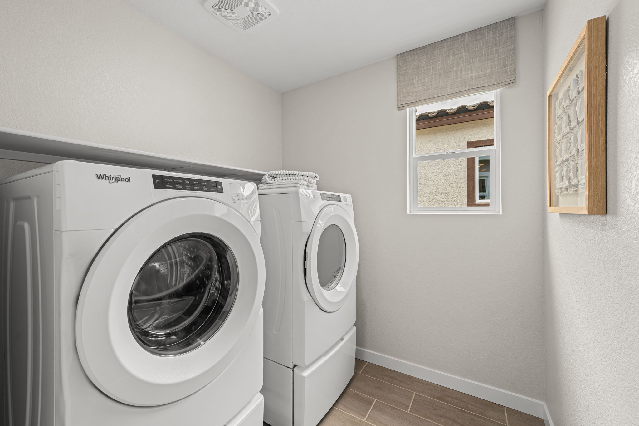 A washing machine in a room.