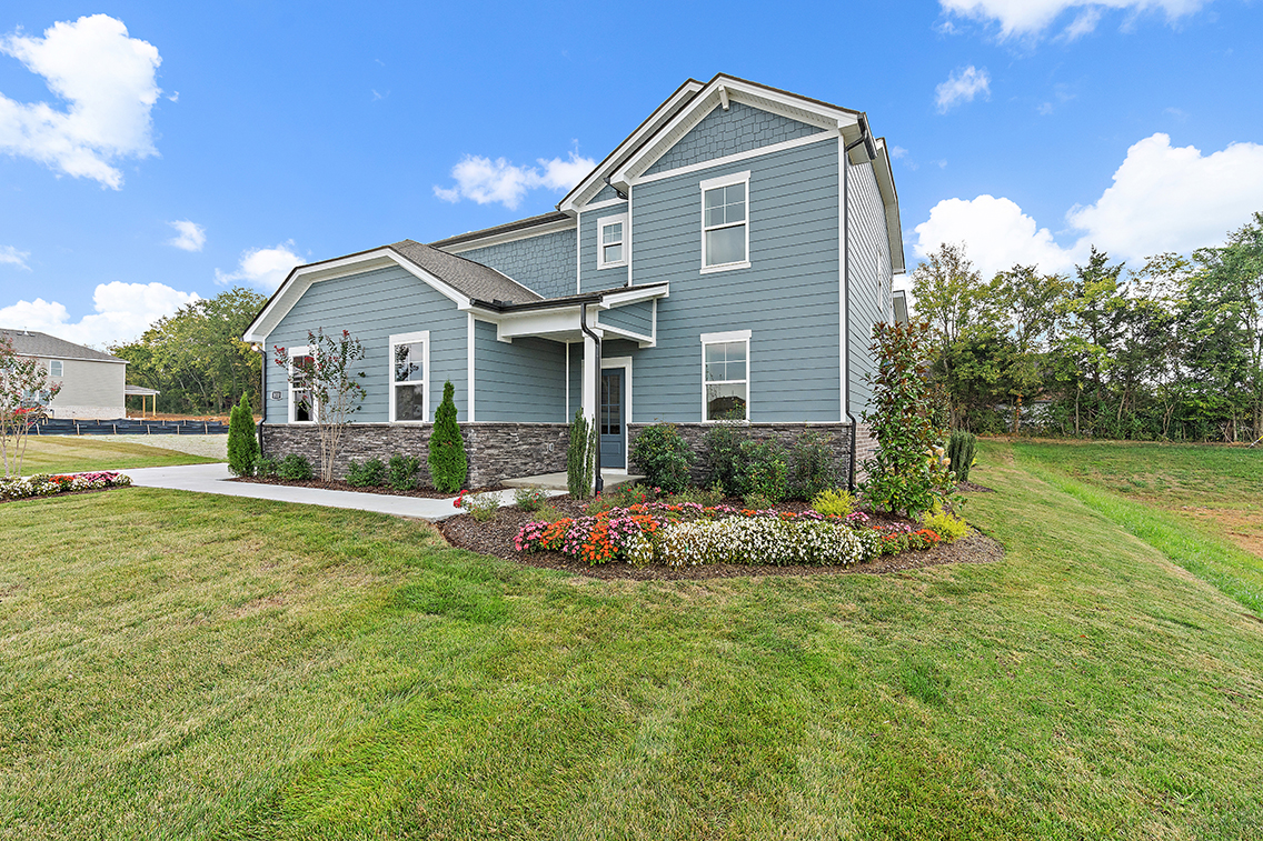 A house with a large front yard.