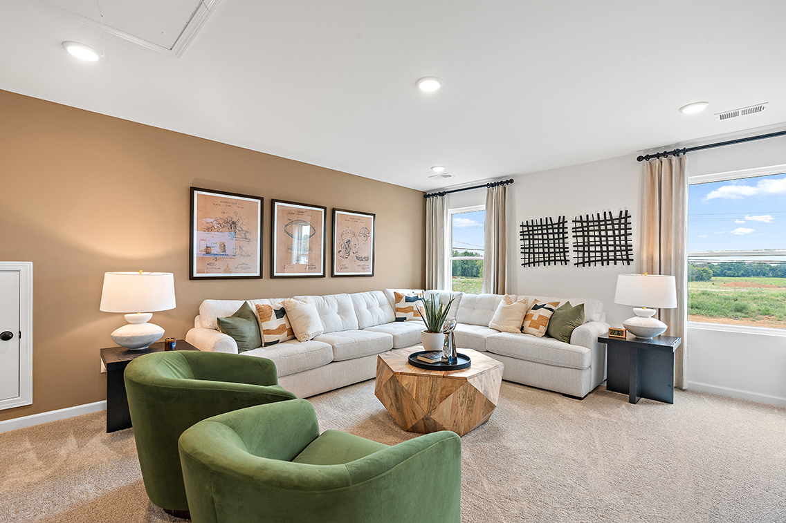 A living room with green couches.