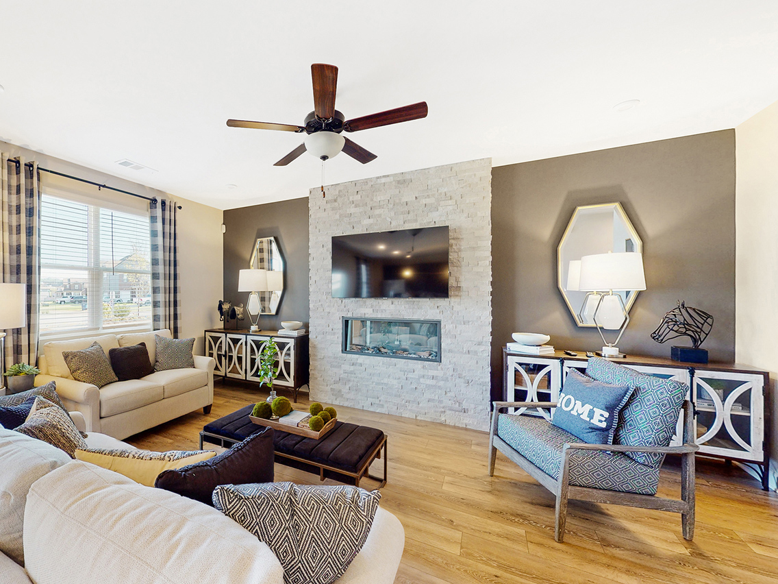A living room with a fireplace.