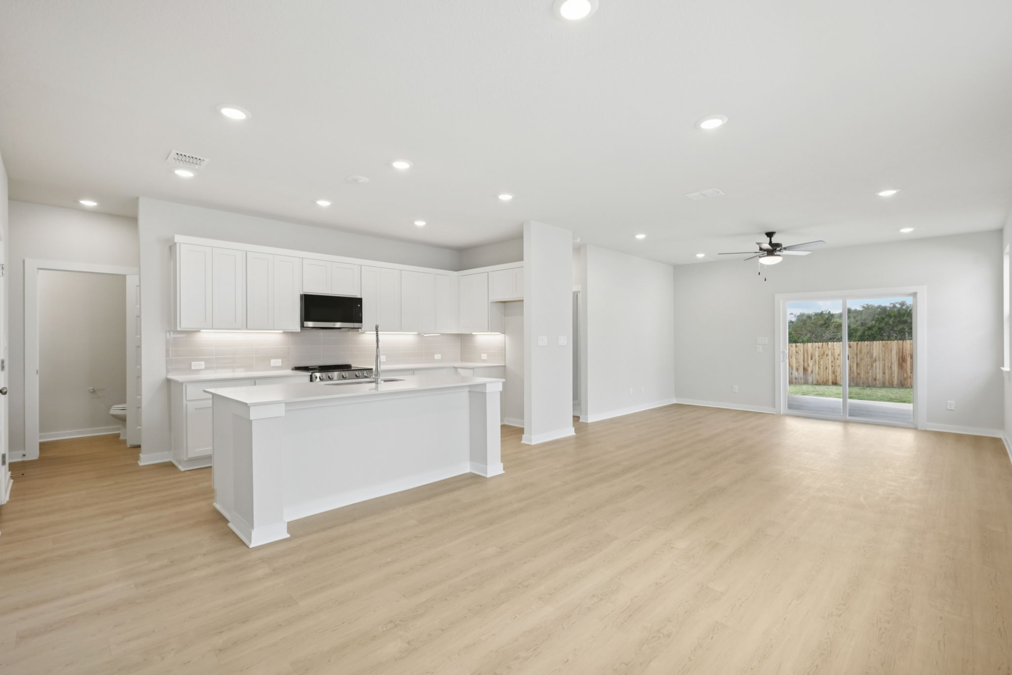 A large kitchen with white cabinets.