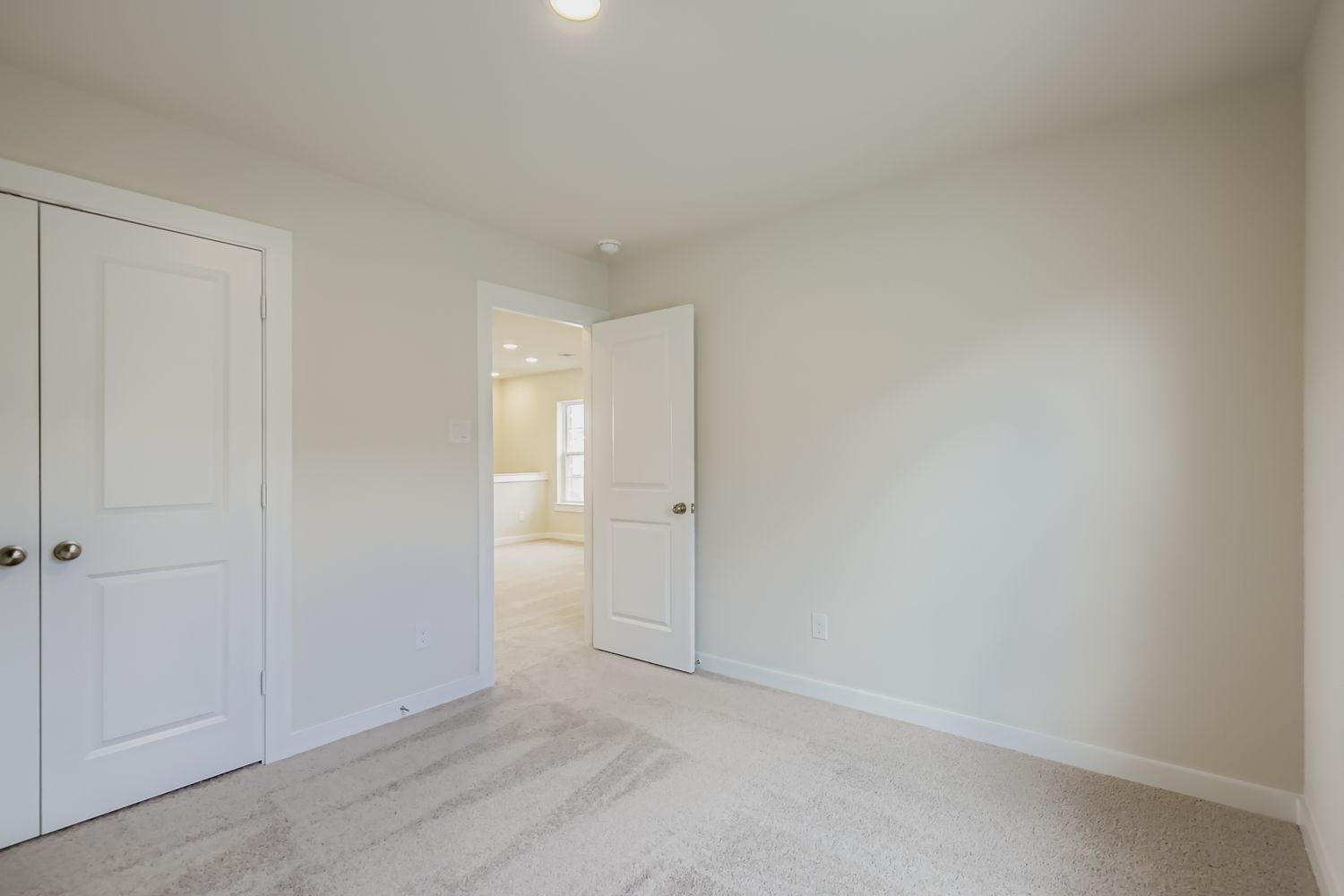 A room with white doors.