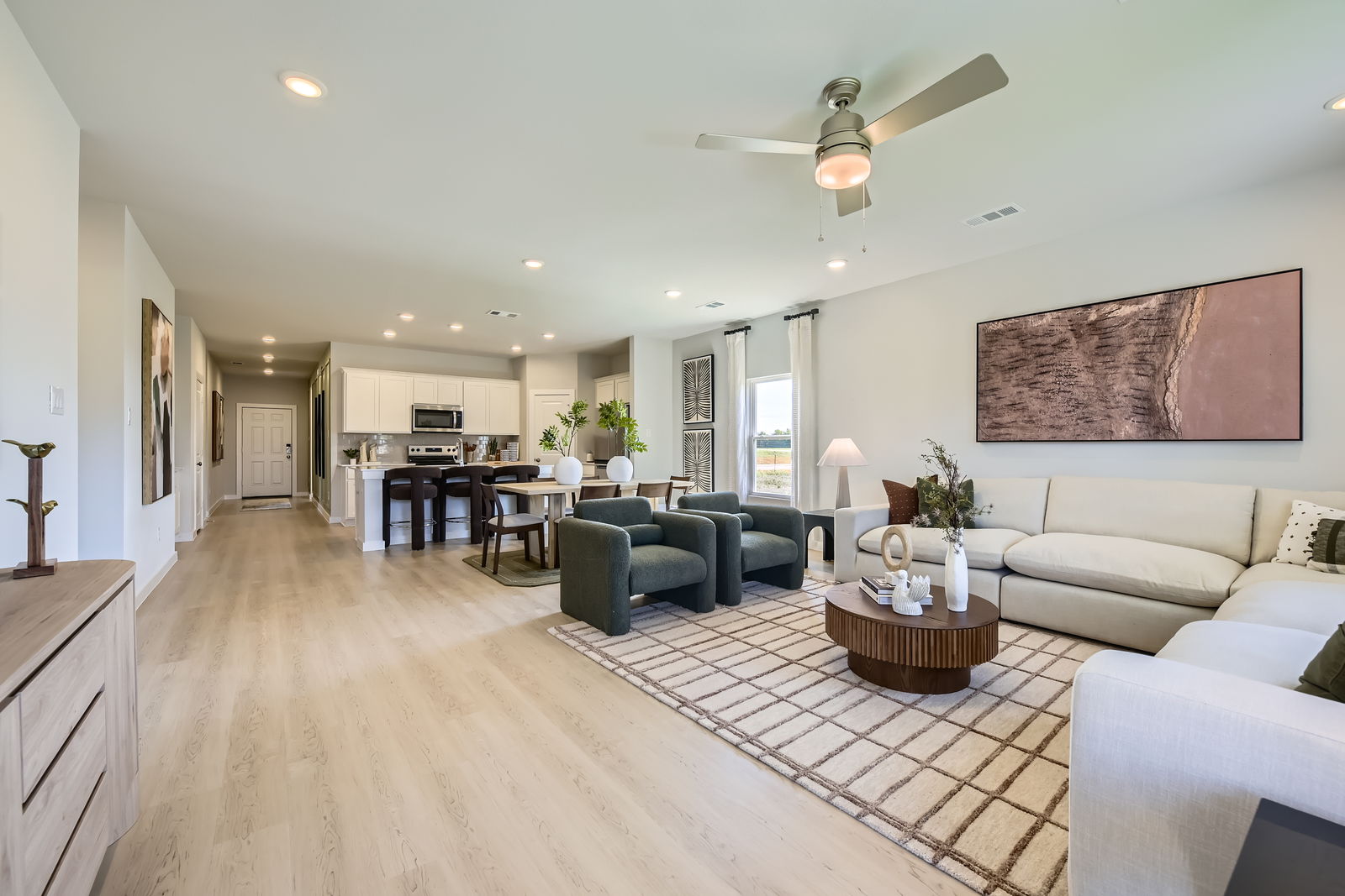 A living room with a wood floor.