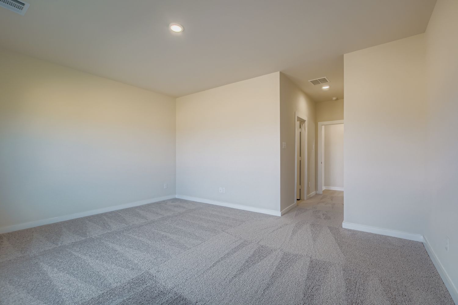 A hallway with white walls.