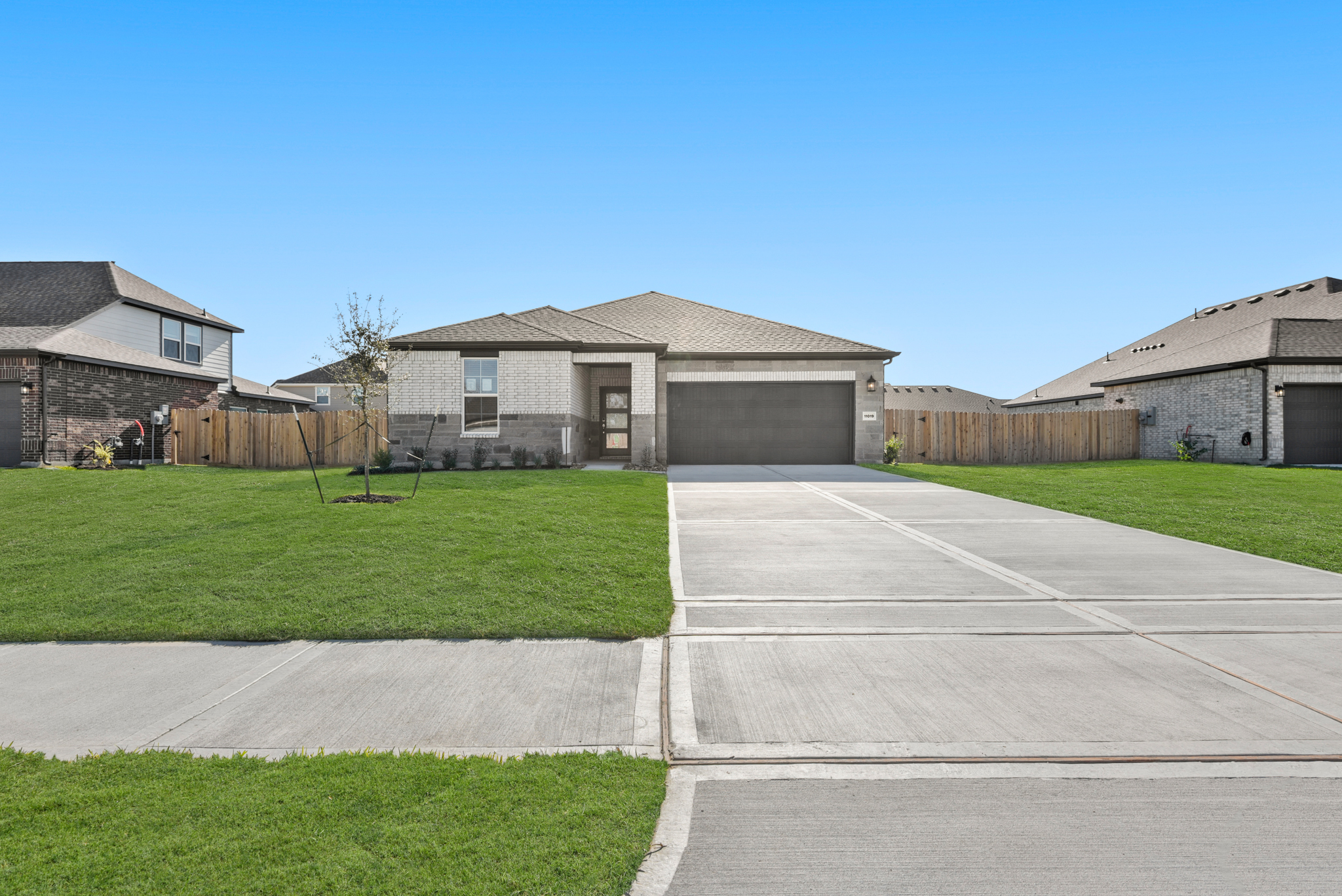 A driveway leading to a house.