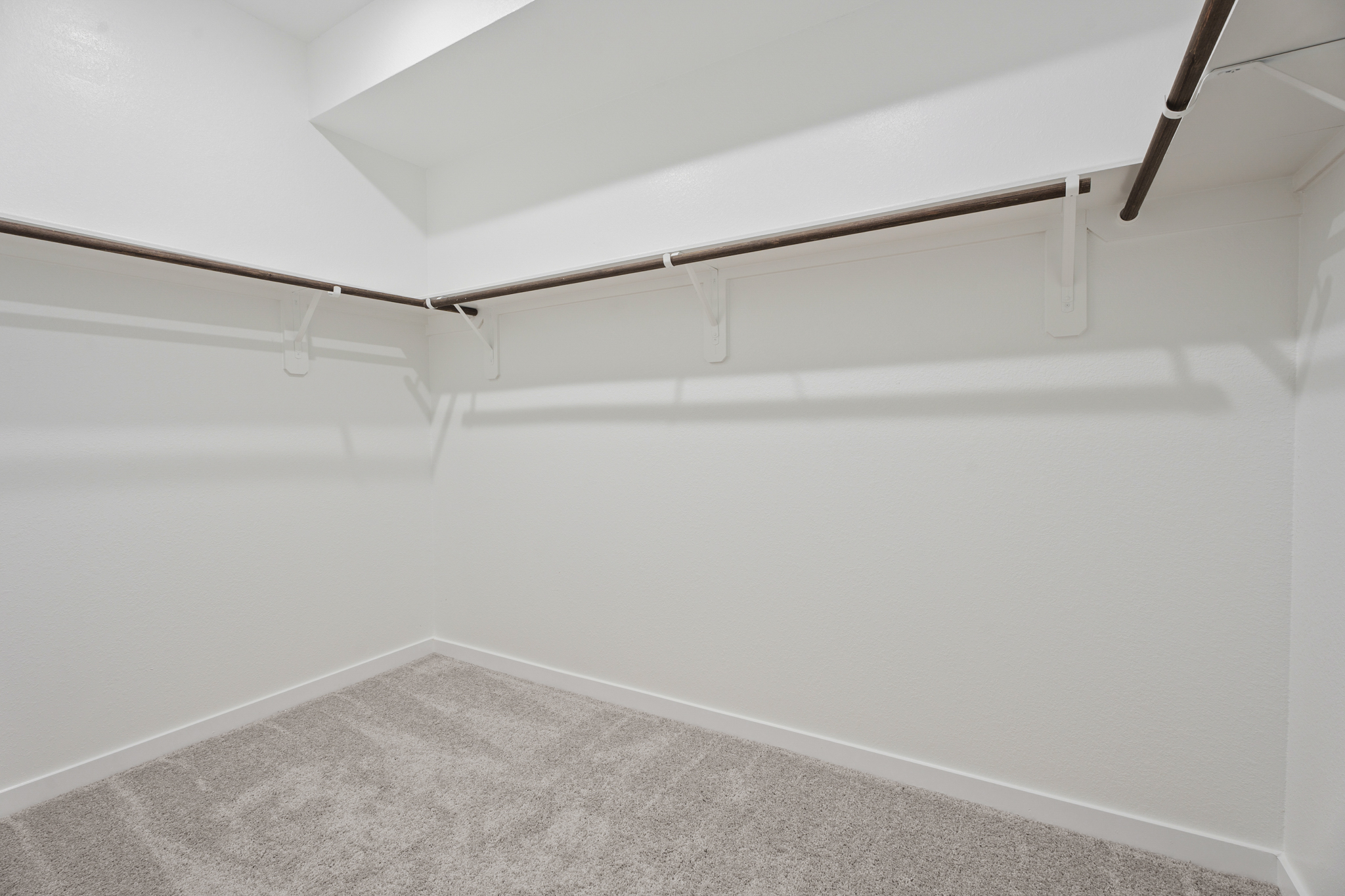 A white wall with a white floor.