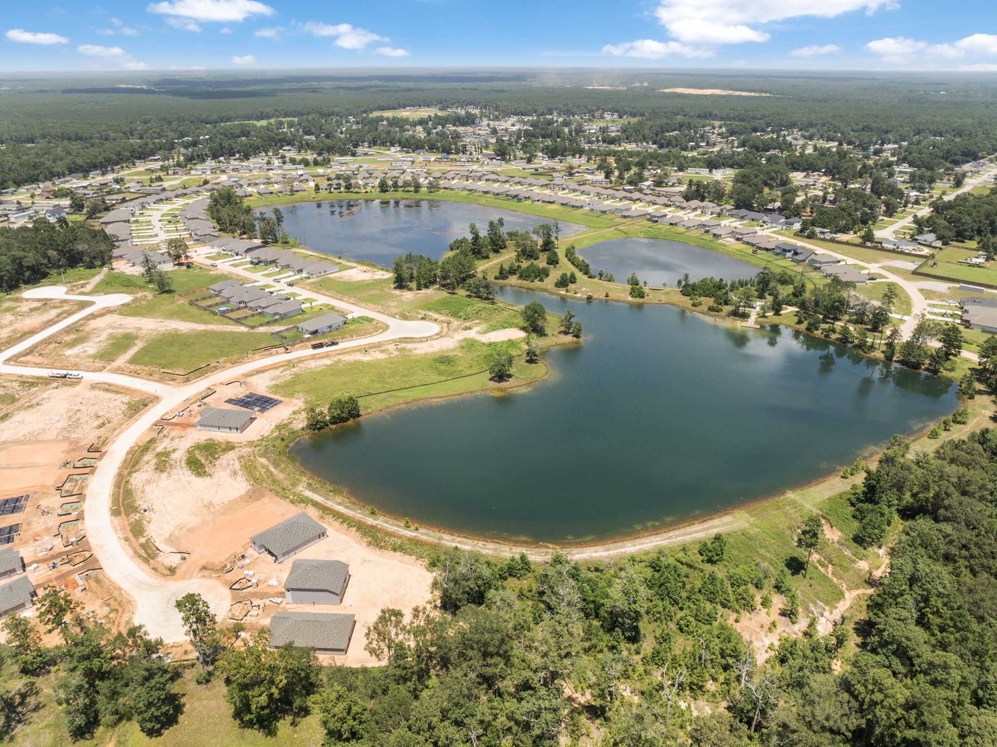 A river with a bridge and buildings.