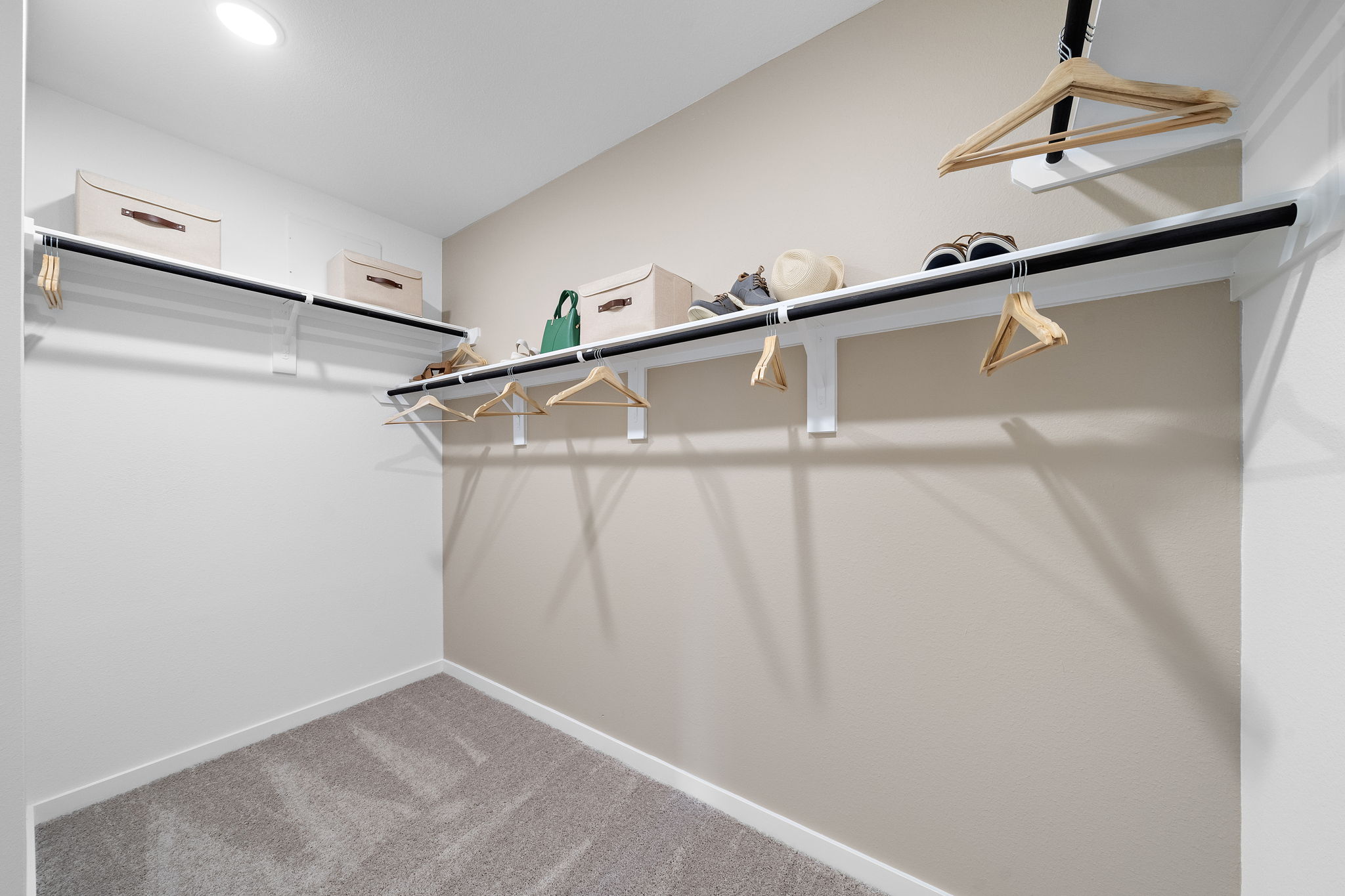 A white wall with a white staircase.