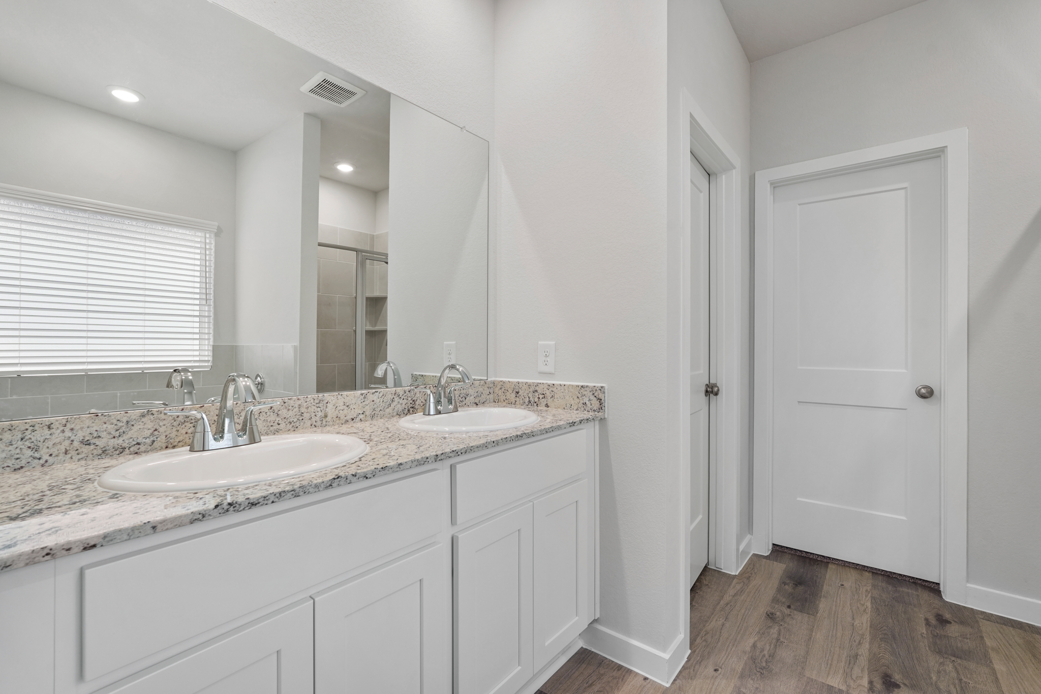 A bathroom with marble counters.