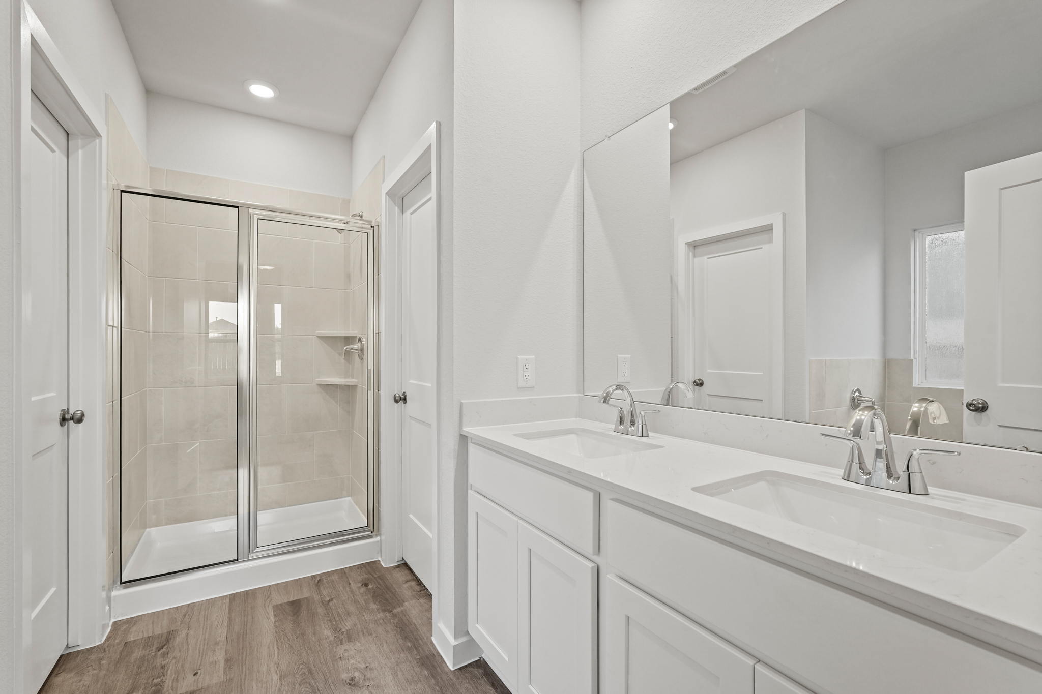 A bathroom with a glass shower.