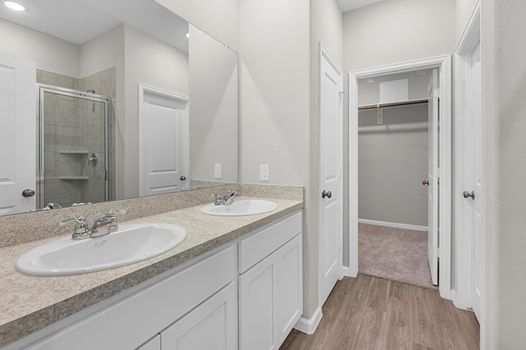 A bathroom with a marble countertop.